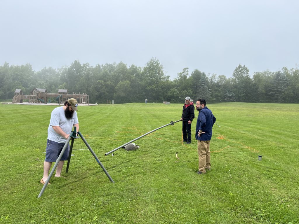 Members putting up a mast for a field day antenna.